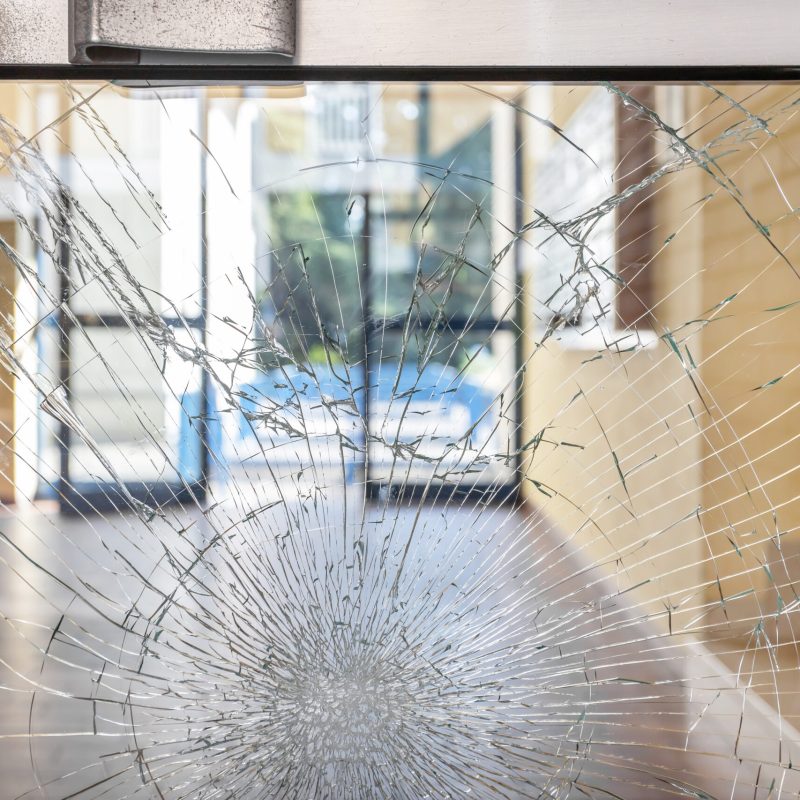 Shattered glass. Concept security theft damage vandalism in an apartment building.